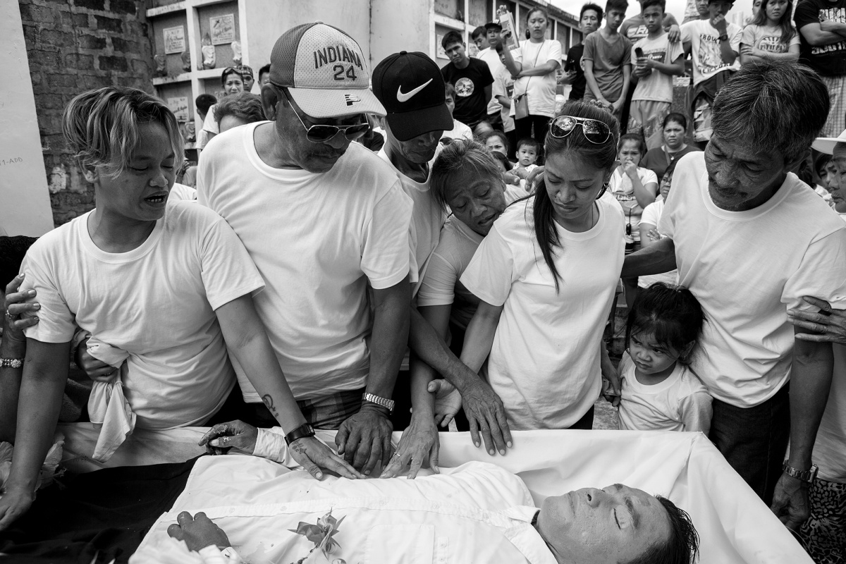 Burial of Jerold Ligalig, 32, a disabled boy killed with several gunshots from covered-face men near his home.